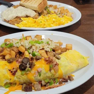 Omelette and chicken fried steak with cubed hash browns with onions &amp; peppers