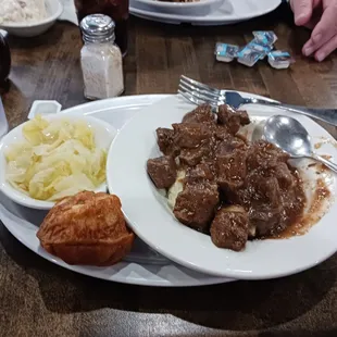 Beef tips over rice with cabbage as a side