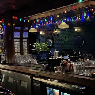 a bar with a laptop on the counter