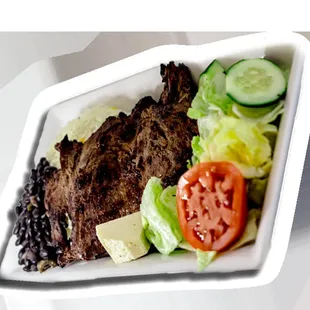 a plate of steak and salad