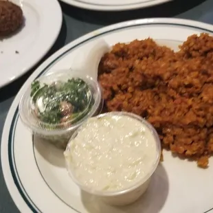 Sleek, baba ghanoush, tabouli, and falafel