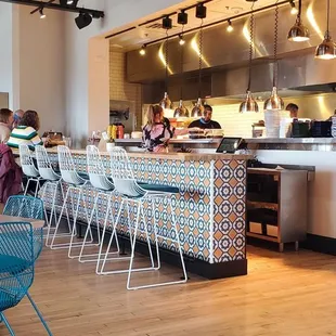 a man sitting at a table in a restaurant