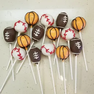 a plate of sports cake popss