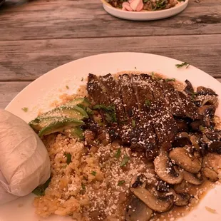 a plate of food on a wooden table