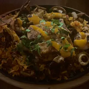 Mexican Paella - sautéed seafood - rice - pico - crema - cilantro - pork belly. SO amazing! Just be careful the skillet is super hot!
