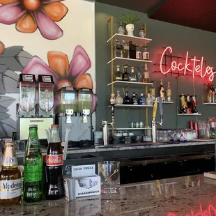 a bar with a neon sign