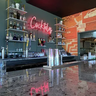 a bar with a neon sign