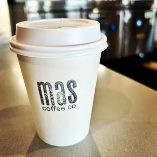 a cup of coffee on a counter