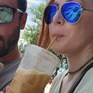 a man and a woman drinking coffee