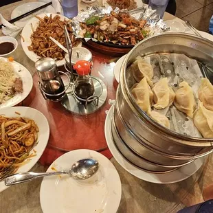 Clockwise from upper left: salt and pepper pork ribs, chow fun, iron type tofu, pork and shrimp dumplings, pork chow mein, house fried rice.