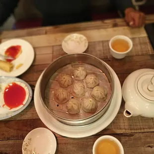 a pot of soup with dumplings in it