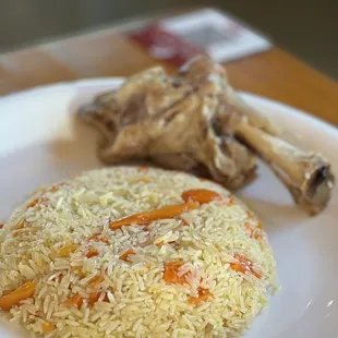 a plate of rice and meat