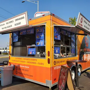 a food truck parked on the side of the road