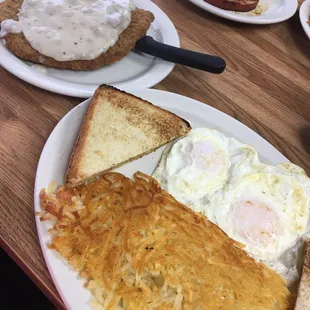 Chicken fried steak with sausage gravy, eggs, hash browns and toast. Excellent!