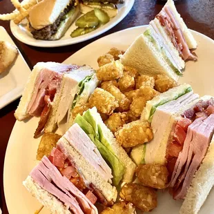 Good portion Clubhouse sandwich, $12.99, w/ crispy tots, all tasty.