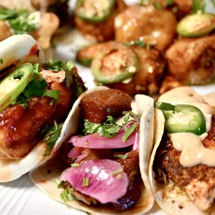a plate of tacos and meatballs