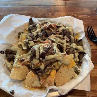 Nachos with chimichurri steak. It was so freaking good. The steak was so tender and flavorful.