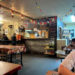 a man sitting at a table in a restaurant