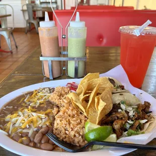 3 delicious tacos with beans and rice