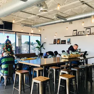 people sitting at tables in a restaurant