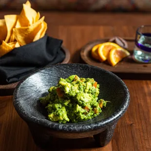 a bowl of guacamole and chips