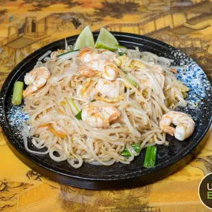 a plate of noodles and shrimp