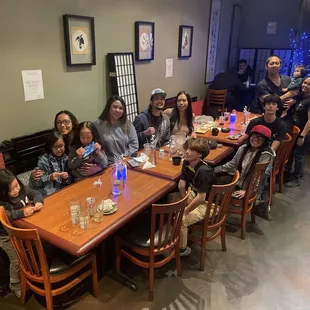 a group of people sitting at a table