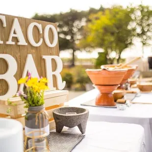 a taco bar set up outside