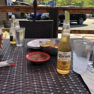 Beers with chips and salsa. Note frozen glass