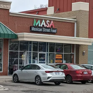 cars parked in front of the store