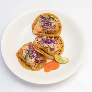 Baja Tacos! Beer battered fish or shrimp, served on a soft corn tortilla &amp; topped with coleslaw and chipotle.