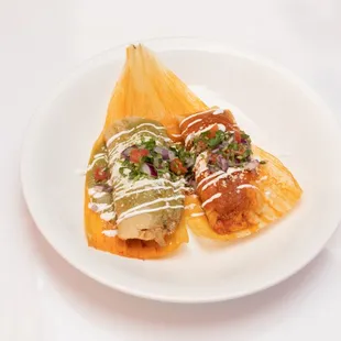 Wet Tamale topped with red or green salsa and pico de Gallo, sour cream, and queso cotija
