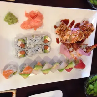 Angry Dragon has the sauce - Rainbow Roll on bottom portion of the picture and Philadelphia Roll in the middle.