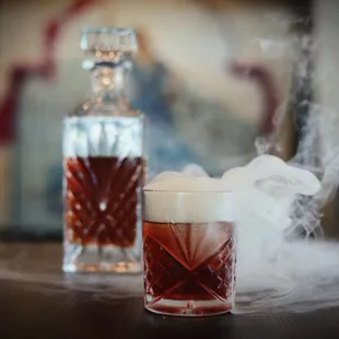 The Smoke Show: Eagle Rare, Carpano Antica, Campari, Smoked Bourbon Soaked Oak