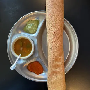 a plate of different sauces and condiments