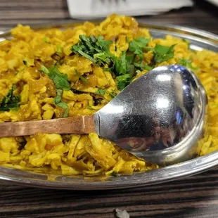 a bowl of rice and a spoon