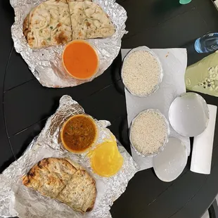 29. Butter Chicken , 53. Lamb Bhuna , 98. Garlic Naan , 103. Keema Naan , Basmati Rice