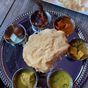 Lunch Thali, Rice under a Papadum, Three kinds of Chicken, Matar Paneer (Peas and Cheese Cubes), Dal (Lentils), and Gulab Jamun . . .