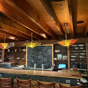 a bar with a chalkboard