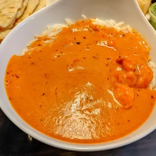 Shrimp Tikki Masala in a rich and tasty tomato sauce with flavorful cumin rice.