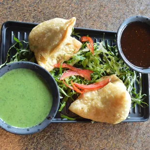 Veg Samosa with mint and tamarind chutney.