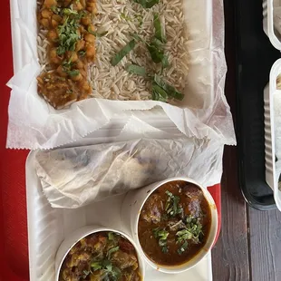 Chickpeas rice, curry fish, spicy eggplant and spicy roti