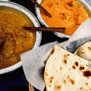 a bowl of soup and pita bread