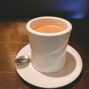 a cup of coffee on a saucer