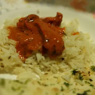 a plate of rice and meat