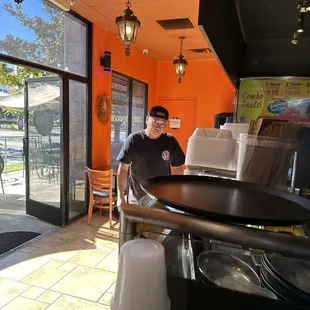 a man sitting at a table in a restaurant