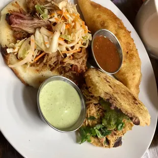 Popusa de chicharrón,  empanada de ropa vieja and my favorite... arepa de pollo.  Yummy