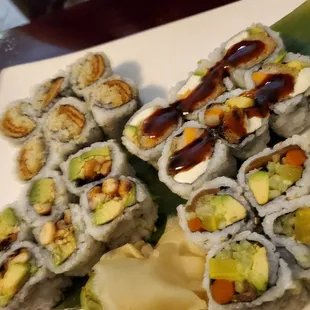 a plate of sushi rolls