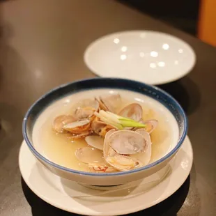 a bowl of clamsel soup on a plate