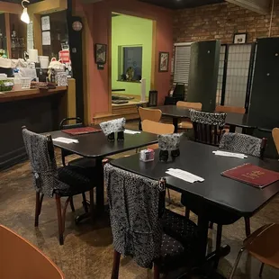 a dining room with tables and chairs